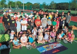 Tennis pros Lee Pettis and Kara Borromeo (on left) are pictured with some of the children at “Tennis Play Day.” (Photo by Bill Kress)