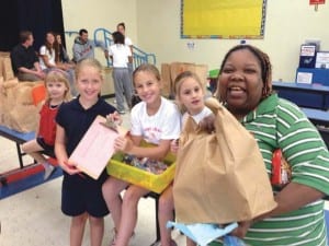 Students from Concordia Lutheran School in Kendall help distribute Thanksgiving food baskets to those in need.