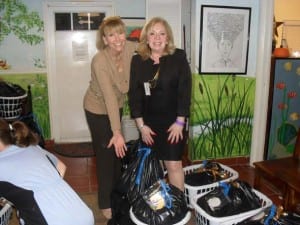 Doral residents Gloria Burns (left) and Lizz Wiegandt with Thanksgiving food baskets donated before the holidaysby Coral Gables Woman’s Club.