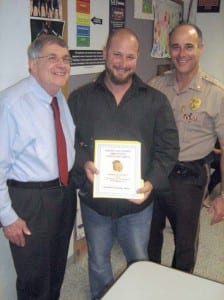 Pictured (l-r) are CAC chair James Blough, Det. Christopher Alfonso, and Maj. Hernan M. Organvidez.