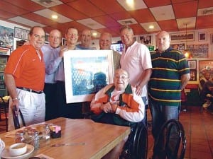 Pictured with retired UM swimming coach Bill Diaz (seated) are former swimmer John Diaz, UM director of alumni programs Rick Remmert, former swimmers Doug Hartman, Steve Lichtner, John Spire, Kurt Weinants and Ken Groce.