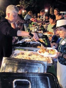 Longtime resident and Mangowood director emeritusRose Van Patten gets her food.