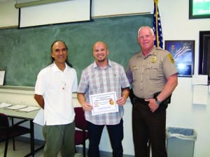 Kendall detective earns honors with arrest of violent suspect