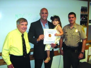 Lifesaving aid earns officer honors from Hammocks CAC