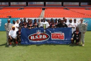 2013 - Carol City High team photo with National Guard at 6th annual Miami Dolphins Academy 7-on-7 High School Football Tournament at Sun Life Stadium