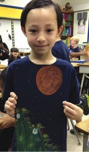 Cody James Knecht holding his winning painting of a Keys tree cactus