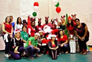 Employees from Interval International, headquartered in South Miami since 1976, gather at the Gibson Bethel Community Center for the company’s annual toy drive. Nearly 350 children received holiday gifts. 