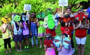 Students from Sunset Park Elementary and St. Thomas Episcopal Parish School display their masks.