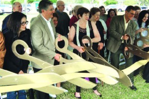 Surrounded by residents are ribbon cutters marking Continental Park improvements, including (l-r) Ela Pestano, aideto Commissioner Xavier Suarez; Marco Osorio, president, Terra Civil Engineering, project engineer; Holly White, president,Continental Park Homeowners Association; Jack Kardys, director, Miami-Dade County Parks, and Aileen Alino, Active Adult Fitness instructor at the park.