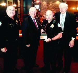 The Borrell Award goes to Officer Norbie Alvarez pictured here with Mayor Edelcup.