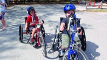 Hand-cycling on bikes keeps two youngsters on track