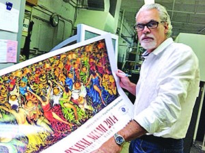 Humberto Benitez is pictured with his poster.