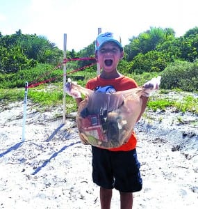 Rotary and Kiwanis Clubs partners for beach clean up