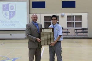 Divine Savior Academy Principal Ben Troge congratulates Christian Rodriguez, one of two National Merit Scholar Semifinalists in the City of Doral