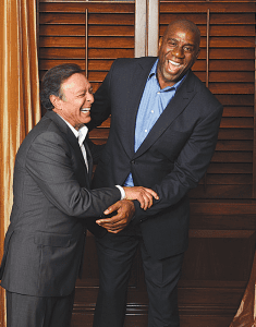 Miguel “Mike” Benito Fernandez is pictured with his friend and business partner NBA legend, Magic Johnson.