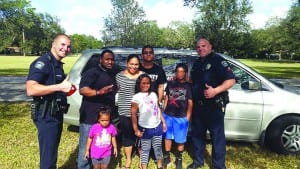 Police help a Secret Santa spread some holiday cheer