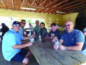 Rotarians and Profit Inc. members gather at Tropical Park