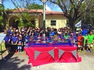 Cub Scouts race homemade cars at annual Pinewood Derby