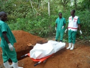 Red cross workers prepare to bury a victim of Ebola. Photo credits: ©EC/ECHO/Jean-Louis Mosser