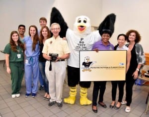 Eagle Eye, Florida Society of Ophthalmology's mascot, joined Miami Dade County District 3 Commissioner Audrey Edmonson, local volunteers and Ophthalmologists, Hilda Capo, MD, Howard Freedman, MD, Stacey Kruger, MD and Laura B. Sims, MD, in a recent free vision screening event at Olinda Park in Miami. 