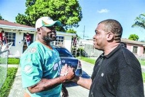 Miami Dolphins alum Lousaka Polite (left) meets veteran Terrence Williams.