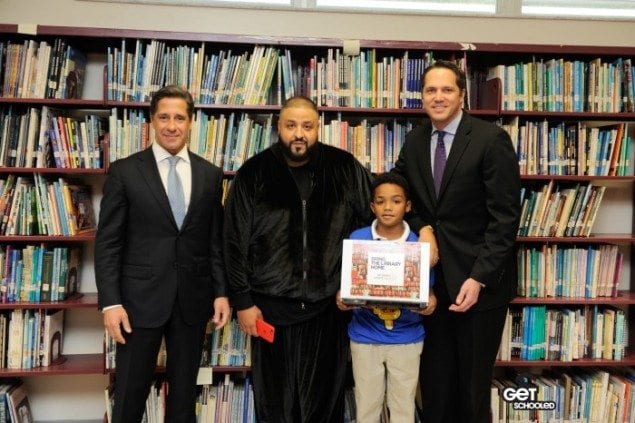 From left, Superintendent Alberto M. Carvalho, Miami-Dade County Public Schools, DJ Khaled, a Miami-based multi-platinum music producer and Miami Gardens restaurateur, Miami Carol Middle School student Rodney Davis, and Derek Cooper, Comcast Florida Region Vice President of Government Affairs and Community Investment. Davis holds the laptop he was given by Comcast in recognition of his efforts as a Student Ambassador during the Get Schooled National Attendance Challenge.