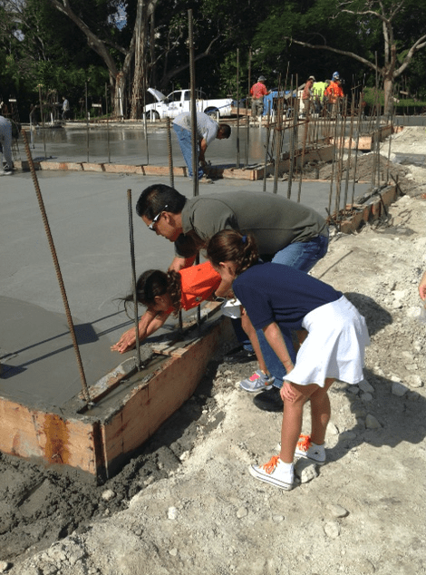 We even have our families place their hands in the freshly poured foundation for an added personal touch!