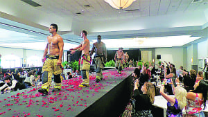 South Florida Fire Fighters strut the runway at Annual Secretary Day’s Luncheon.