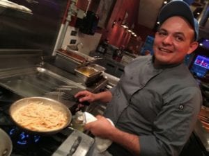 Chef Gustavo Ribera is busy in the kitchen of Alaine’s Osteria in Palmetto Bay.