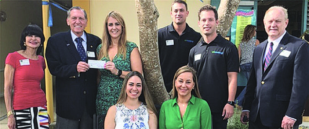 Rotary presents $900 check to Pinecrest Elementary for sneaker collection