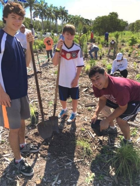 Volunteers pitch in to help clean wetland in restoration project