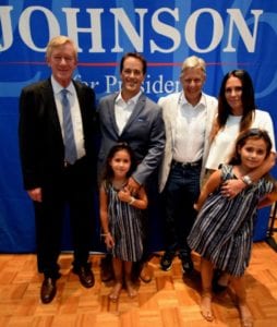 Gathering at a step-and-repeat-banners during a pre-rally reception are (l to r) Gov. Bill Weld. Alex Almazan, Gov. Gary Johnson, Danielle Almazan and their daughters Reese and Avery Almazan.