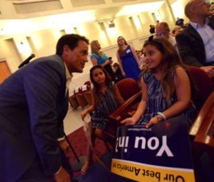 Attorney Alex Almazan shares a moment with his two daughters Reese and Avery (l to r) just before the FIU rally begins. 