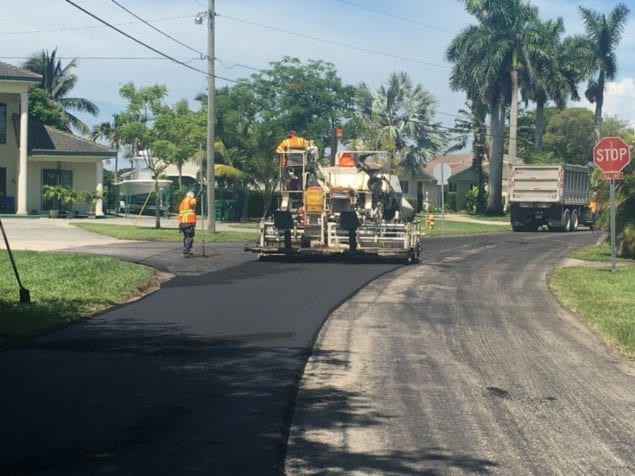 The paving equipment and crew are pictured working on one of the streets in Cutler Bay’s Whispering Pines community.