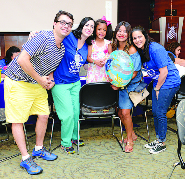 Kamila Santos, 5, who was born at 28 weeks of gestation and spent three months in the NICU, shares a smile as she reunites with some of her former caregivers.