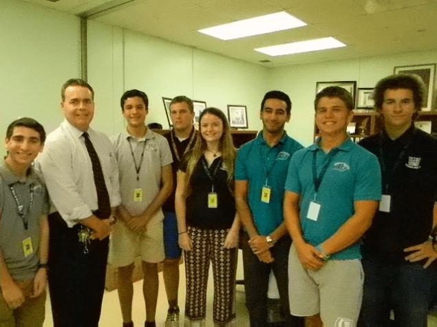 Pictured (l-r) are Daniel Crair; Thomas Ennis, principal; Dario Amador-Lage; Timothy Whiddon; Leila Halley- Wright; Mahmoud Fahmy; Kyle Dickson, and Gianni LaVecchia.