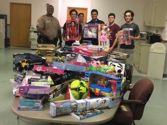 Gulliver students help town's Policing Unit with toy drive