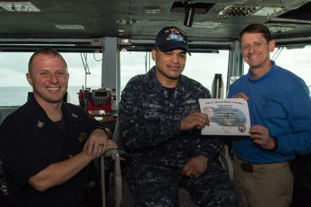 Seaman Sanka Harris receives ship's 'Sailor of the Day' award