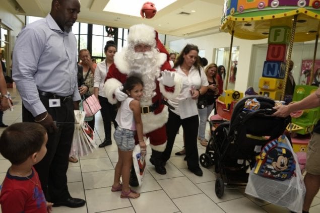 Santa Claus arrives to begin holiday season at Southland Mall