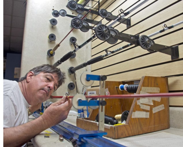 Captain Randy Towe wraps a guide on one his custom rods that he manufactures in the Florida Keys. A Keys residents since 1983, Towe manufactures rods from fly to heavy offshore gear for anglers seeking high-end equipment crafted from high-quality parts. Photo by Andy Newman/Florida Keys News Bureau