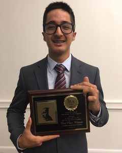 Santiago Guzman receives scholarship in Alpha Phi Alpha oratorical contest