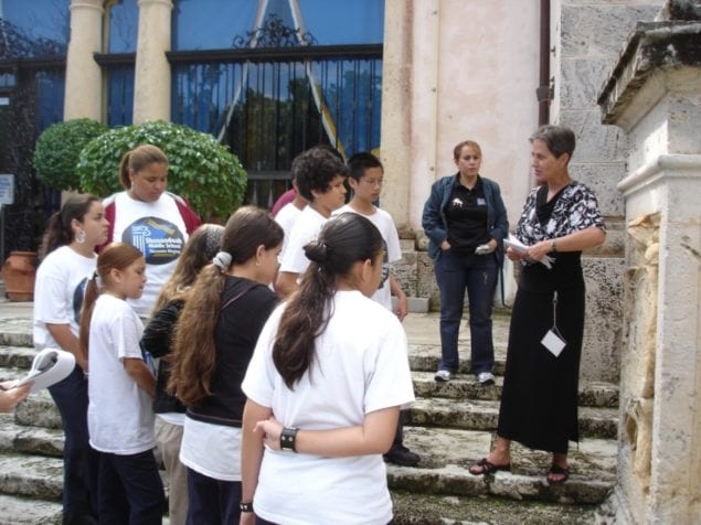 Vizcaya Museum and Gardens volunteer guides lead interactive tours for visitors.