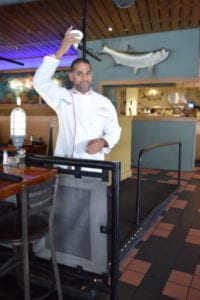 Tarpon Bend owner Wayne explores better solutions to minimize the impact his Coral Gables restaurant has on the environment, such as installation of LED lamps.