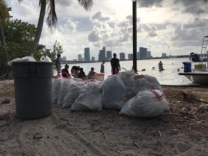 DFO crew finishing up a long day of hauling in loads of plastic, garbage, and other ocean debris recently off Key Biscayne.