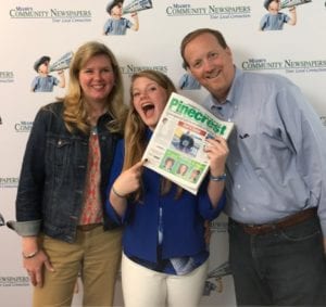 In between takes, Julie, Delaney, and Robert Reynolds catch up on the local news.