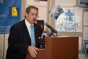 Commissioner Diaz speaks at the autism awareness event.