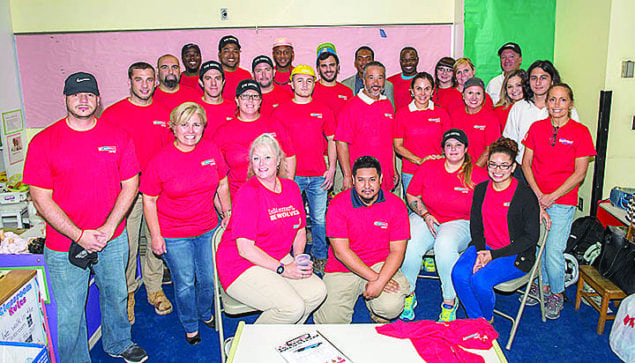 Suffolk Construction volunteers work to renovate childcare center