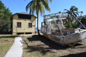 Two vessels washed onto the estate, including this derelict fishing boat that apparently hit the boathouse on its way in.