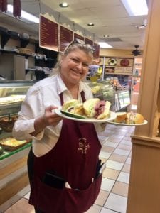 Tonya Gay serves Lots of Lox's delicious sandwiches. 