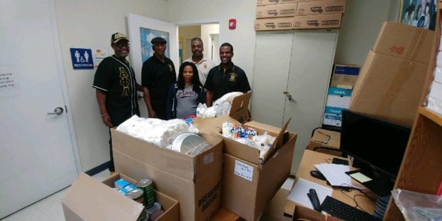 Alphas, Devon Aire K-8 Center bring Thanksgiving baskets to area families